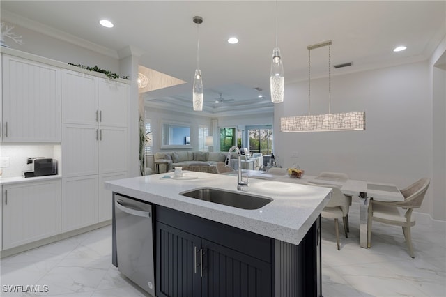 kitchen featuring white cabinets, sink, dishwasher, hanging light fixtures, and an island with sink