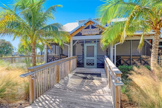 exterior space featuring a sunroom