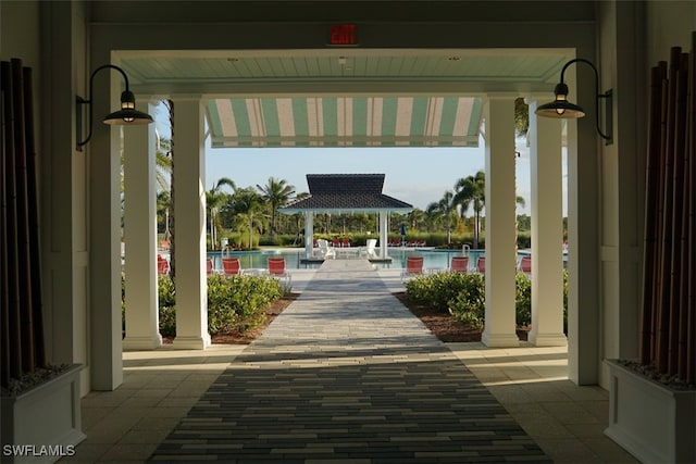 surrounding community featuring a gazebo and a pool