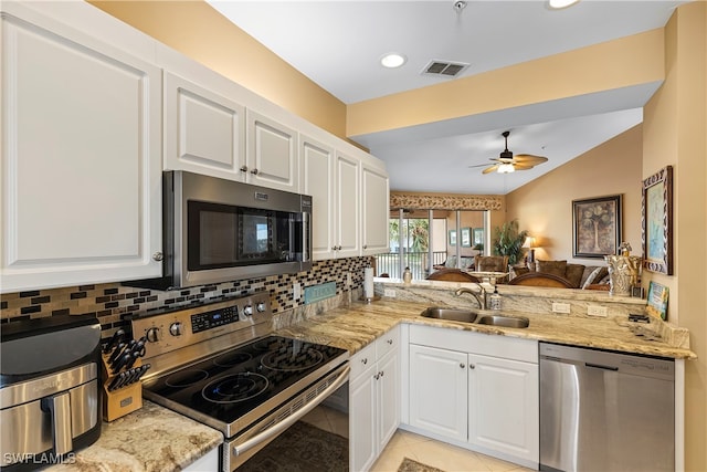 kitchen featuring white cabinets, sink, ceiling fan, kitchen peninsula, and stainless steel appliances