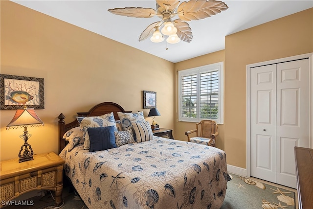 carpeted bedroom with a closet and ceiling fan