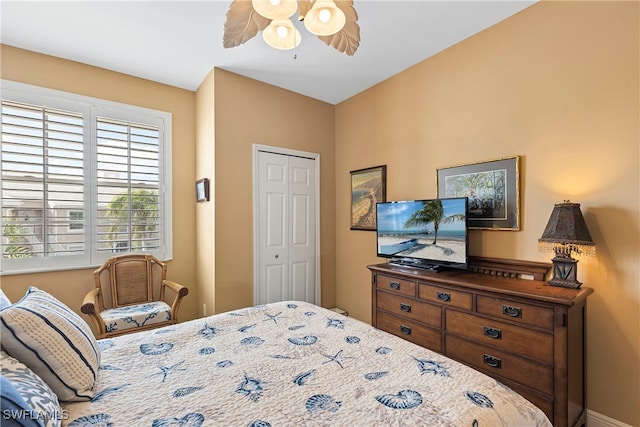 bedroom with a closet and ceiling fan