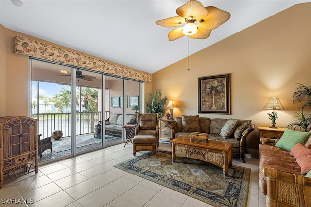 tiled living room with ceiling fan and vaulted ceiling