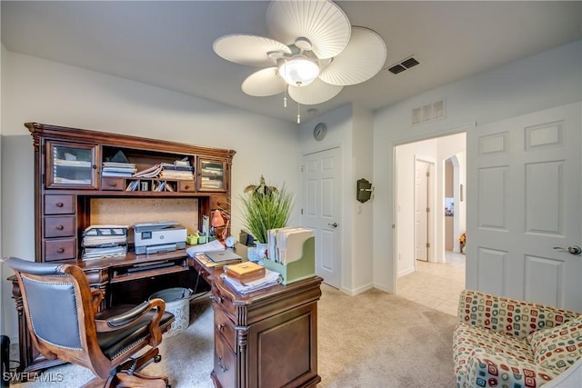 office area with light carpet and ceiling fan