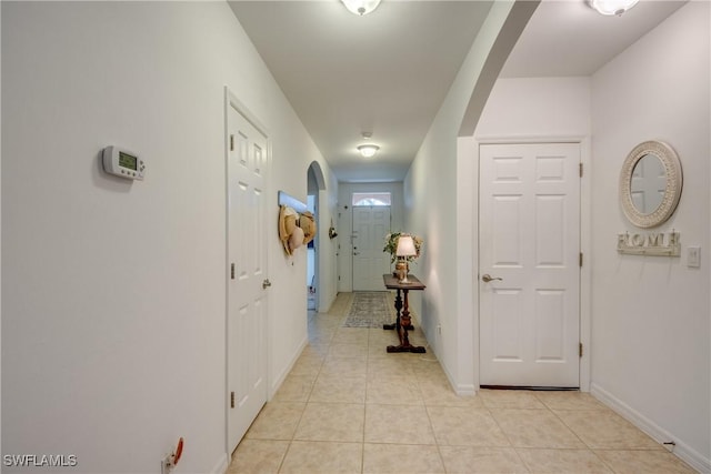 hallway featuring light tile patterned floors