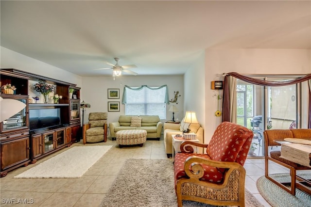 tiled living room with ceiling fan