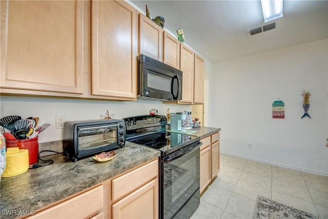 kitchen with light brown cabinets, light tile patterned floors, and black appliances