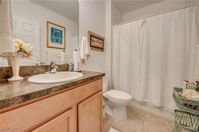 full bathroom with vanity, tile patterned floors, toilet, and shower / bathtub combination with curtain