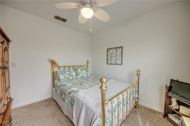 bedroom with ceiling fan and light carpet