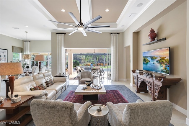 tiled living room with crown molding and ceiling fan