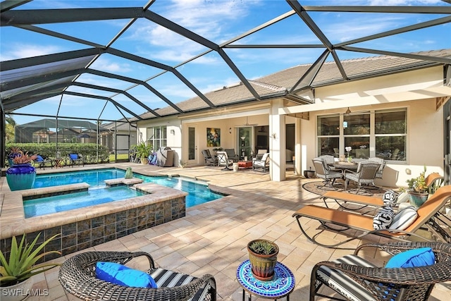 view of swimming pool with a lanai, a patio area, an in ground hot tub, and an outdoor living space