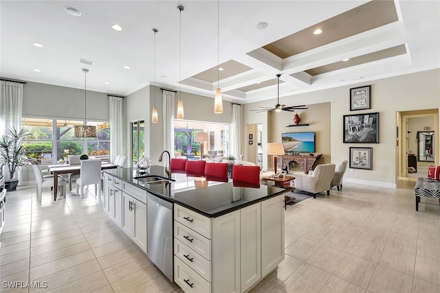 kitchen featuring dishwasher, plenty of natural light, sink, and hanging light fixtures