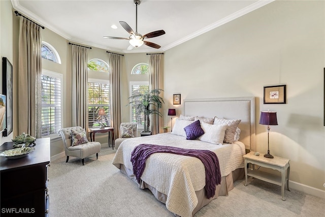 carpeted bedroom featuring ceiling fan and ornamental molding