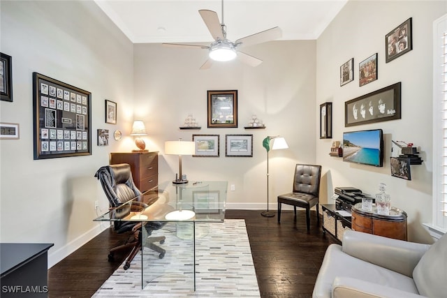 living area with ceiling fan, dark hardwood / wood-style flooring, and crown molding