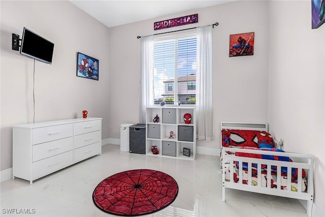 bedroom with marble finish floor and baseboards