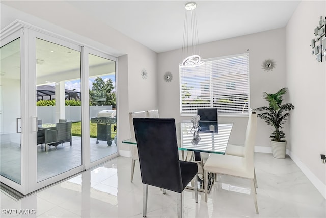 dining area featuring baseboards