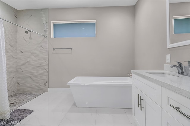 full bathroom featuring vanity, a soaking tub, marble finish floor, and tiled shower