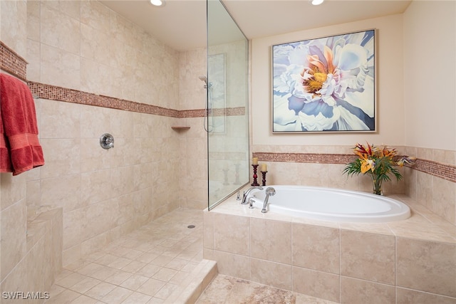 bathroom with separate shower and tub