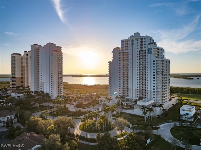 aerial view at dusk with a water view