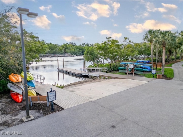 view of patio / terrace with a dock and a water view