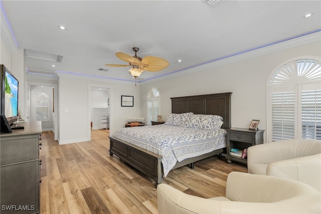 bedroom featuring ceiling fan, crown molding, and light hardwood / wood-style flooring