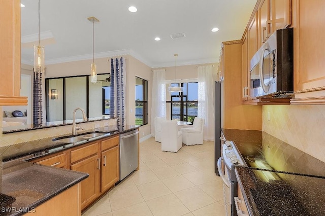 3741 Pleasant Springs Dr, Naples, FL 34119 - kitchen with dark stone countertops, visible vents, hanging light fixtures, a sink, and appliances with stainless steel finishes