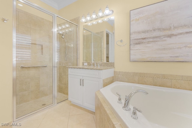 bathroom featuring tile patterned flooring, vanity, and independent shower and bath