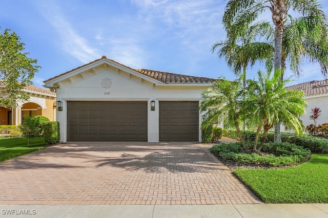 mediterranean / spanish-style home featuring a garage