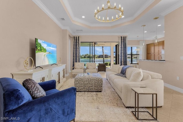 3741 Pleasant Springs Dr, Naples, FL 34119 - living area with visible vents, light tile patterned floors, a notable chandelier, crown molding, and a tray ceiling