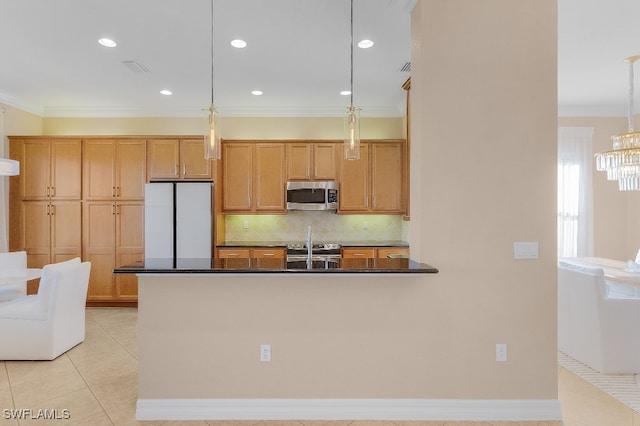 kitchen featuring backsplash, ornamental molding, hanging light fixtures, and appliances with stainless steel finishes