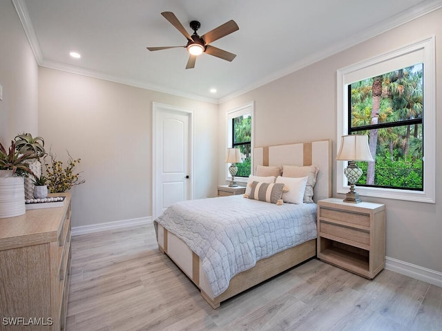 bedroom with ceiling fan, crown molding, and light hardwood / wood-style flooring