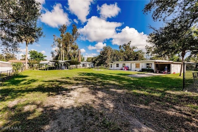 view of yard with a carport