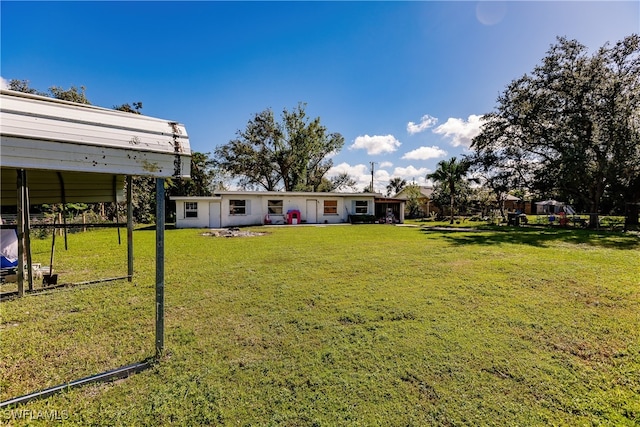 view of yard featuring a carport