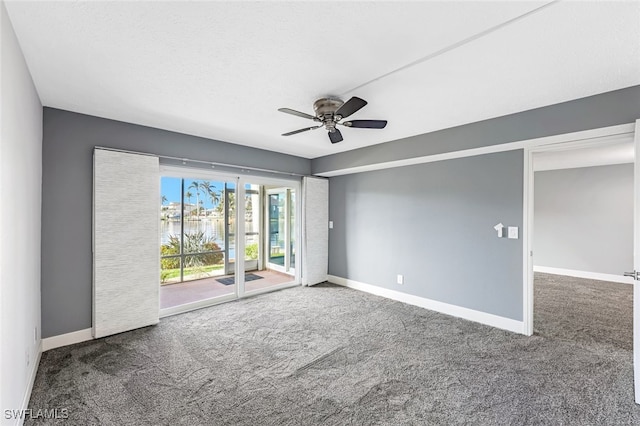 unfurnished room with baseboards, carpet floors, a textured ceiling, and ceiling fan