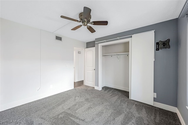 unfurnished bedroom featuring a ceiling fan, baseboards, visible vents, carpet floors, and a closet