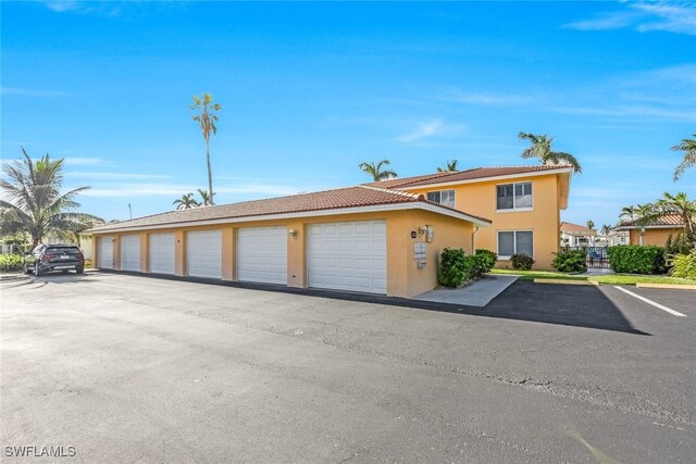 view of front of house featuring community garages and stucco siding