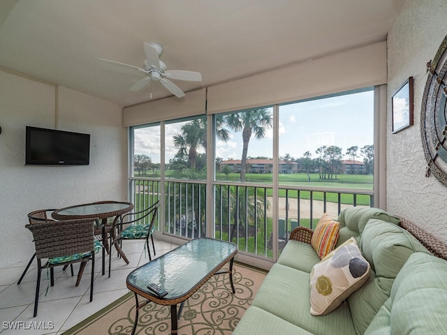 sunroom featuring a wealth of natural light and ceiling fan