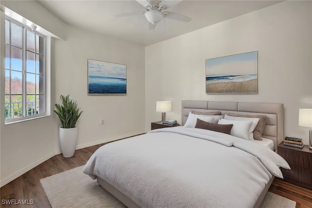 bedroom with wood-type flooring and ceiling fan