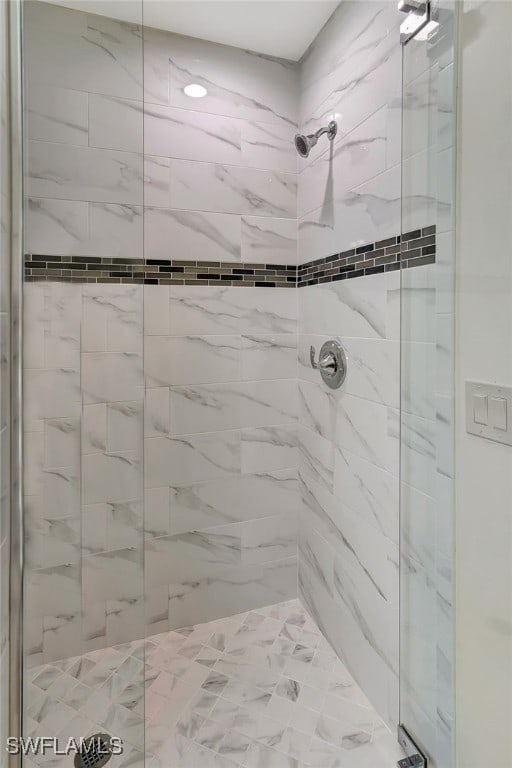 bathroom with tiled shower