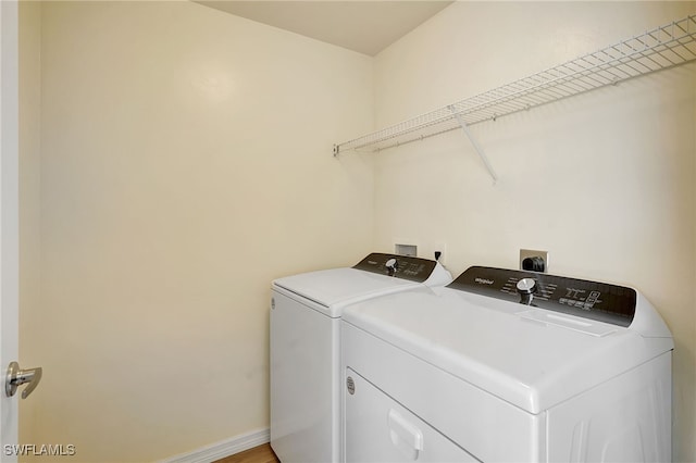 laundry area with washer and clothes dryer