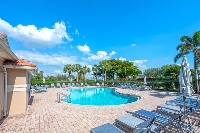 view of swimming pool with a patio area