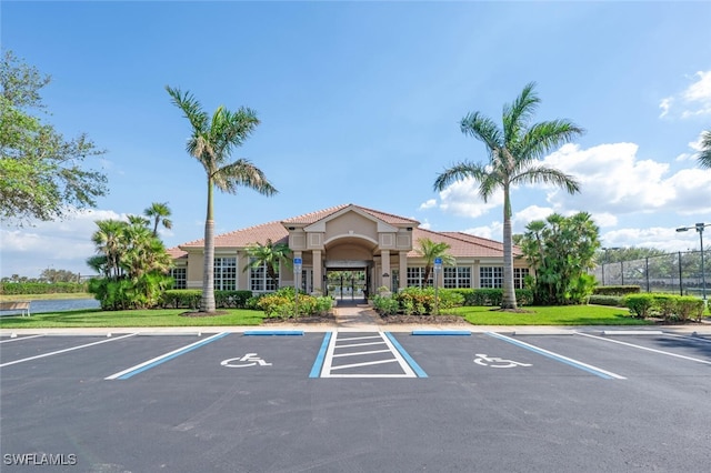 26414 Lucky Stone Rd Unit 101, Bonita Springs, FL 34135 - view of building exterior with uncovered parking