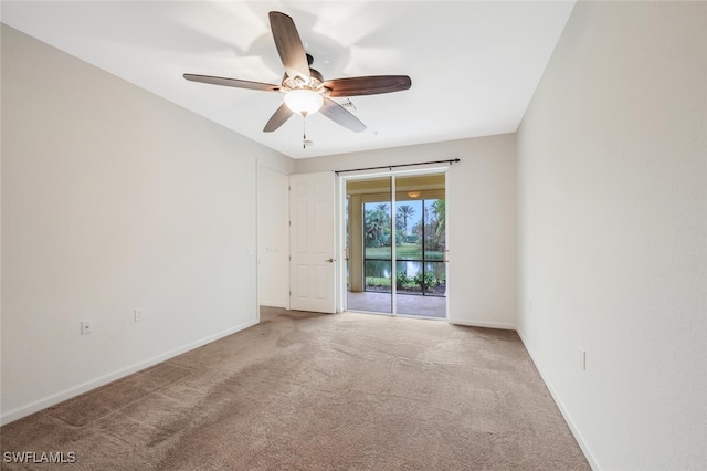 unfurnished room with carpet and ceiling fan