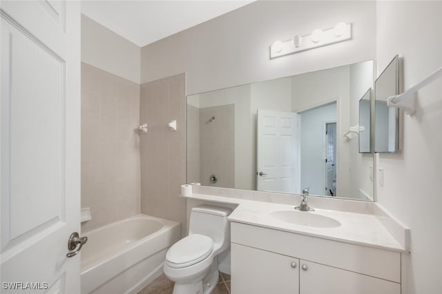 full bathroom featuring vanity, tiled shower / bath, and toilet