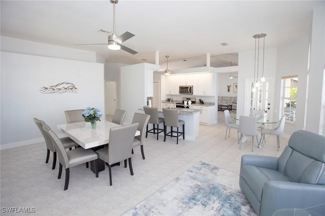 dining space with ceiling fan