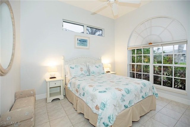 tiled bedroom with ceiling fan