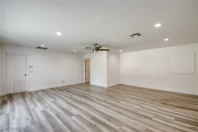 empty room with light hardwood / wood-style flooring and ceiling fan