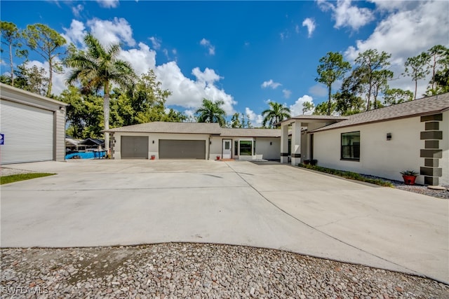 single story home featuring a garage