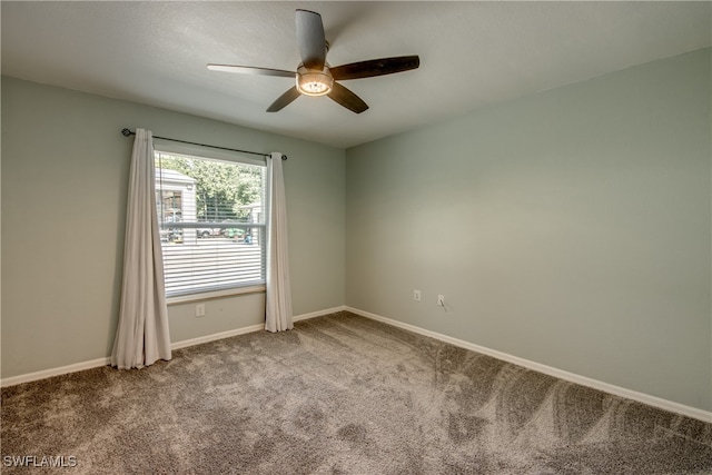 unfurnished room with carpet flooring and ceiling fan