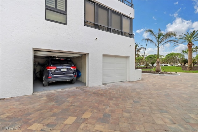 view of side of home with a garage